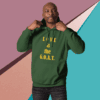 Man wearing a green hoodie with 'LOVE is the G.O.A.T.' printed in yellow.