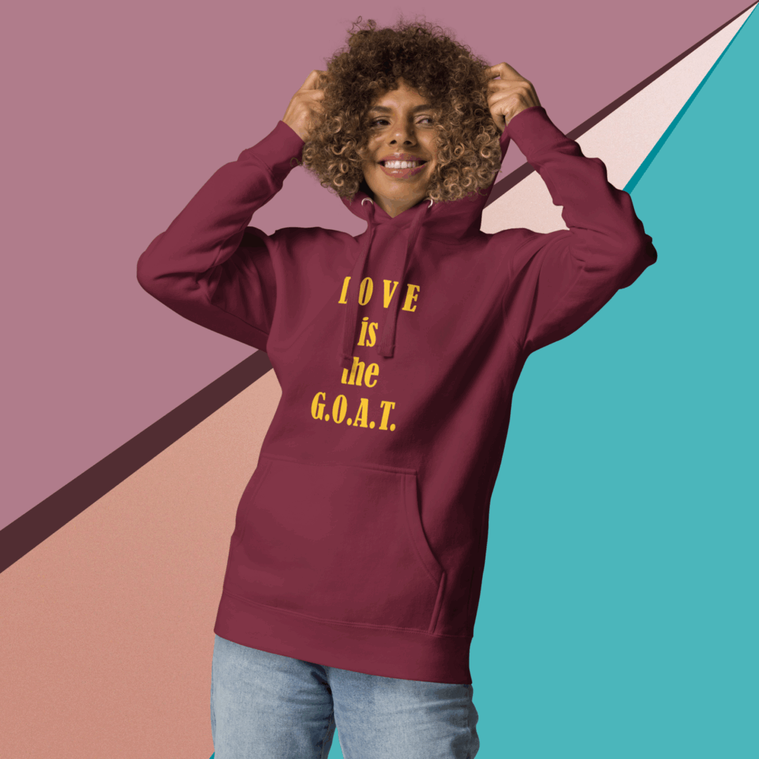 Person wearing a maroon hoodie with yellow text.
