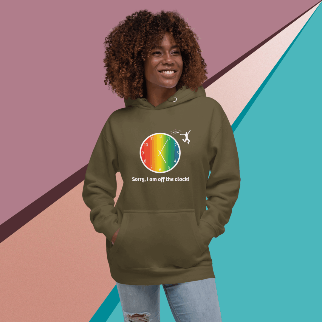 Smiling woman wearing an oversized olive green hoodie with a colorful circular design.