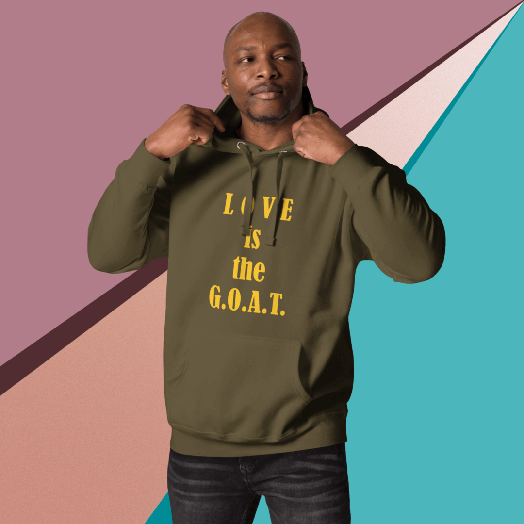 Man wearing a green hoodie with yellow text against a colorful geometric background.