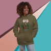 Smiling woman in green hoodie with a graphic print, standing against a colorful geometric background.