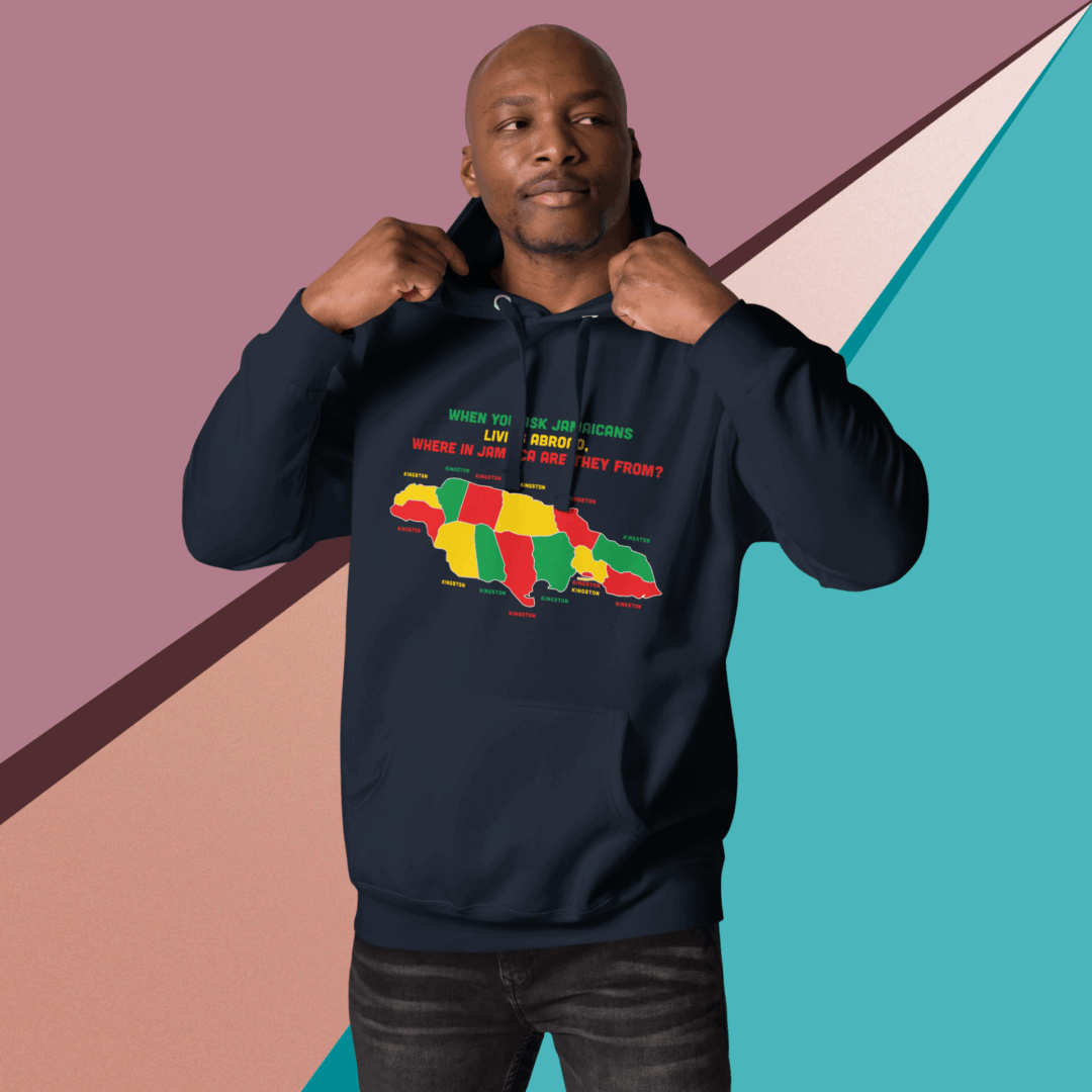 Man wearing a black hoodie with colorful map design on a geometric background.