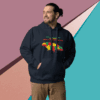 Man wearing a colorful hoodie with a map design stands against a geometric background.