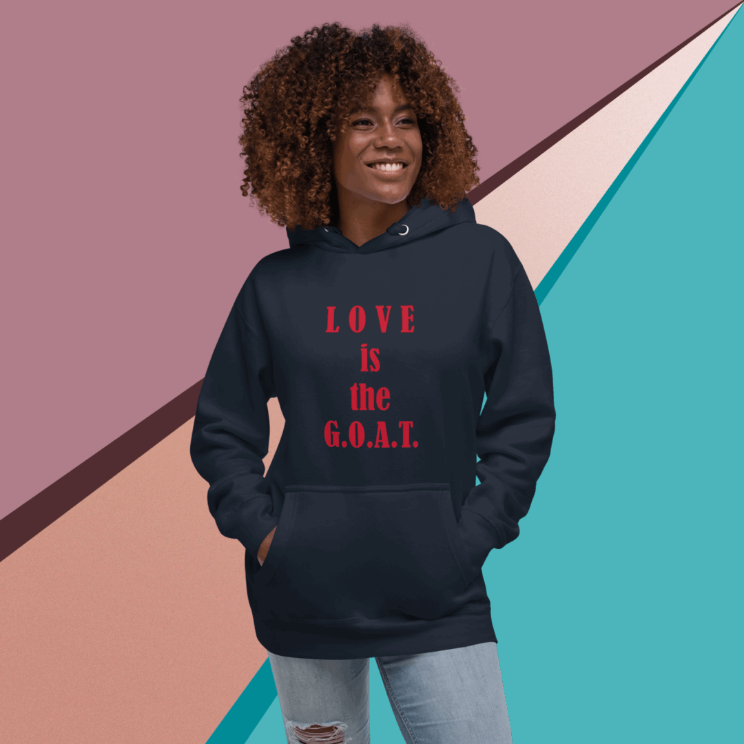 Smiling woman wearing a black hoodie with a motivational quote.