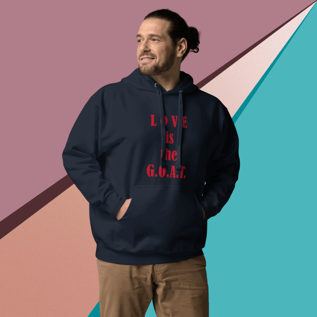 Man smiling while wearing a navy hoodie with red text.