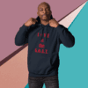 Man posing confidently in a navy hoodie with red text.