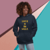 Woman wearing a navy hoodie with 'LOVE is the G.O.A.T.' text.