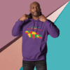 Man wearing a purple hoodie with a colorful dinosaur graphic.