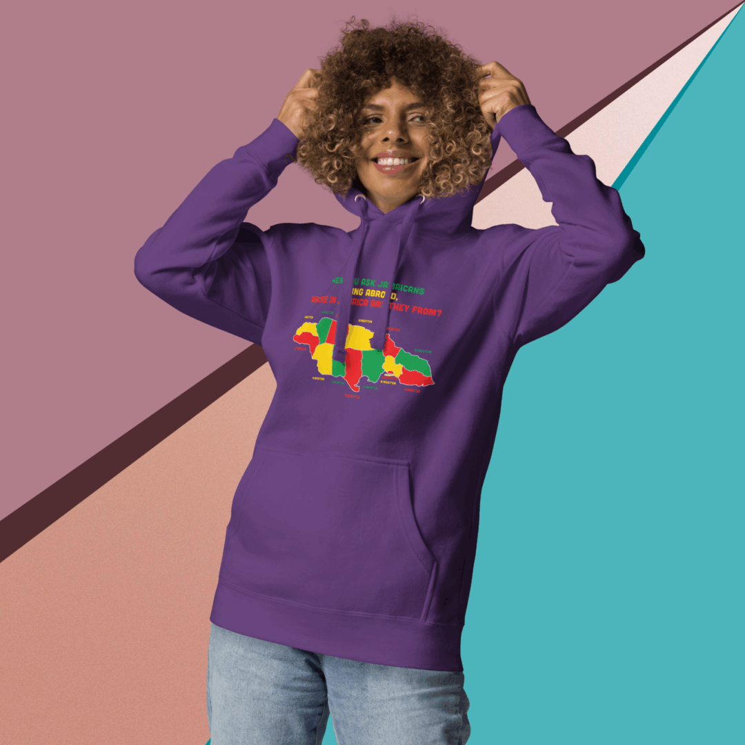 Smiling woman in a purple hoodie with colorful design poses against a geometric background.