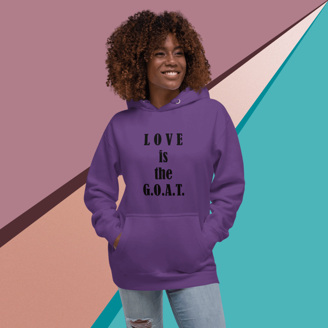 A woman in a purple hoodie with "LOVE is the G.O.A.T" text.