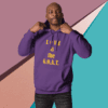 Man in purple hoodie with 'LOVE is the G.O.A.T.' text.