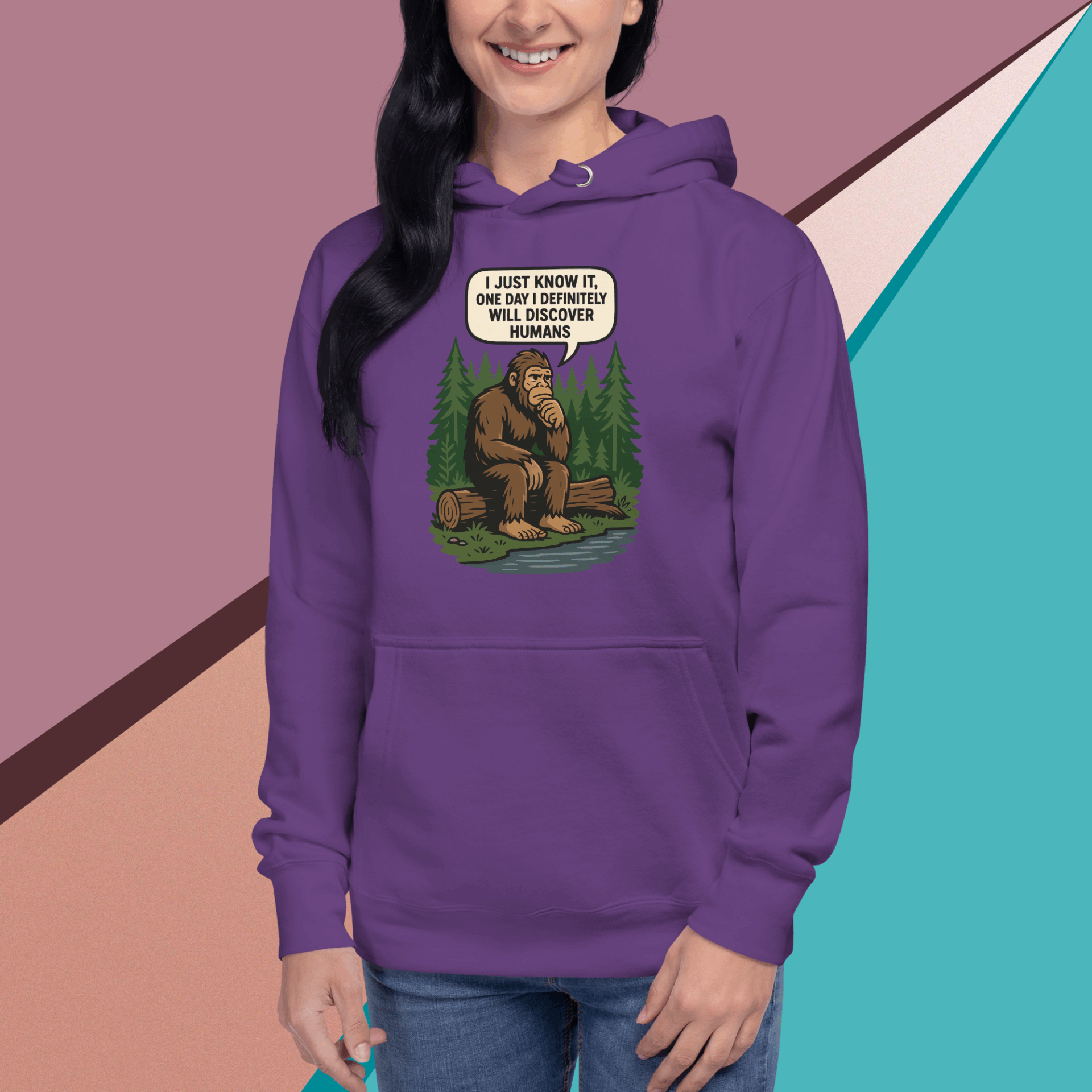 Person wearing a purple hoodie with a Bigfoot cartoon and text.
