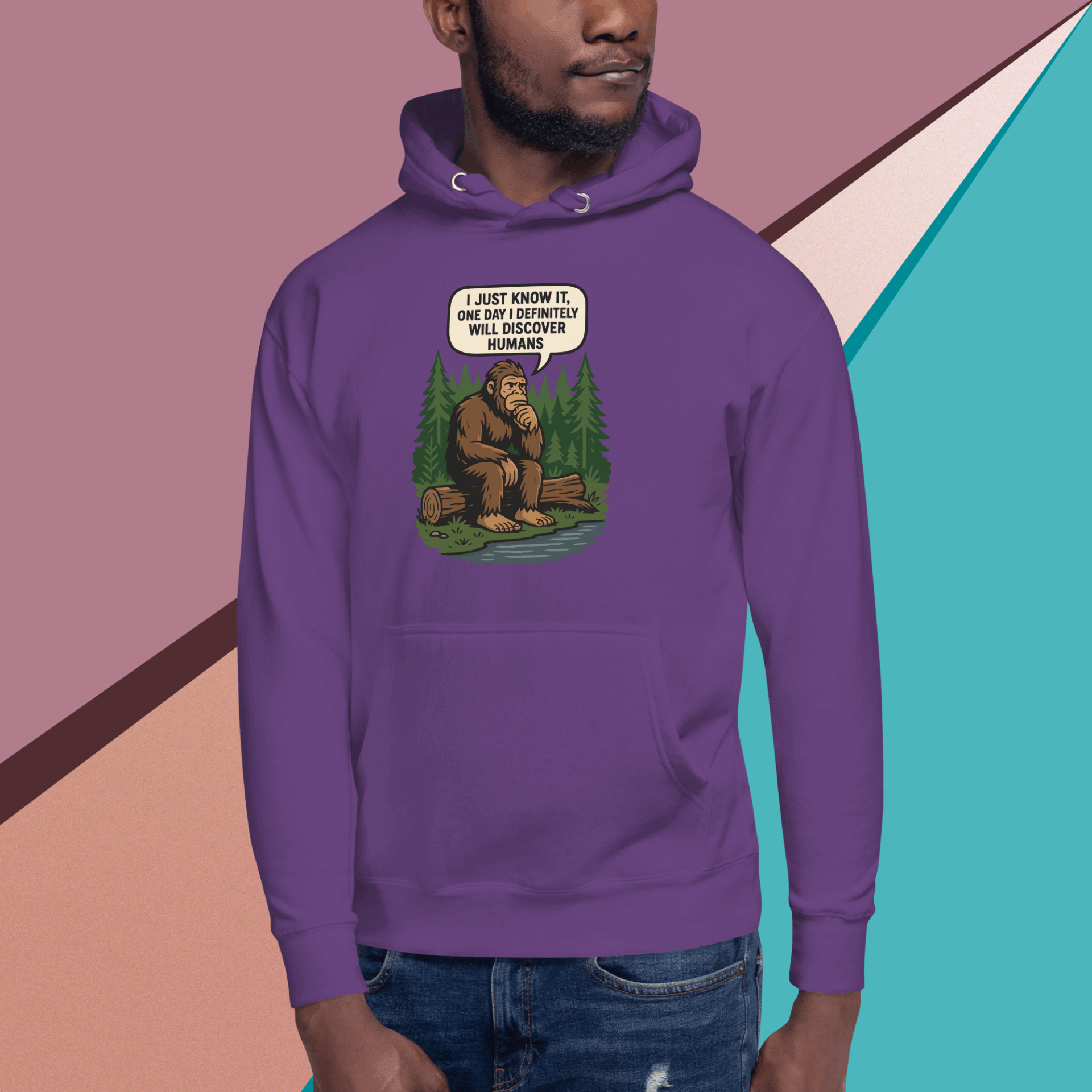 Man wearing a purple hoodie with a humorous bear graphic.