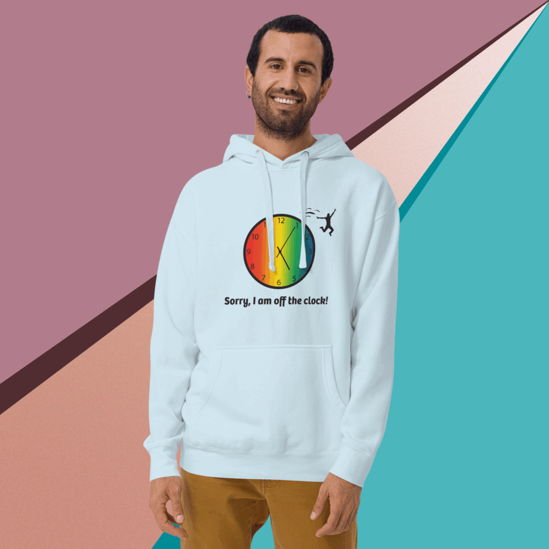cotton-heritage-m2580-i-unisex-premium-pullover-hoodie-sky-blue-front-68e3240736336 Man smiling in a colorful hoodie with a rainbow circle design.