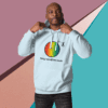 cotton-heritage-m2580-i-unisex-premium-pullover-hoodie-sky-blue-front-68e32646874f5 Man wearing a light blue hoodie with a colorful graphic and text.