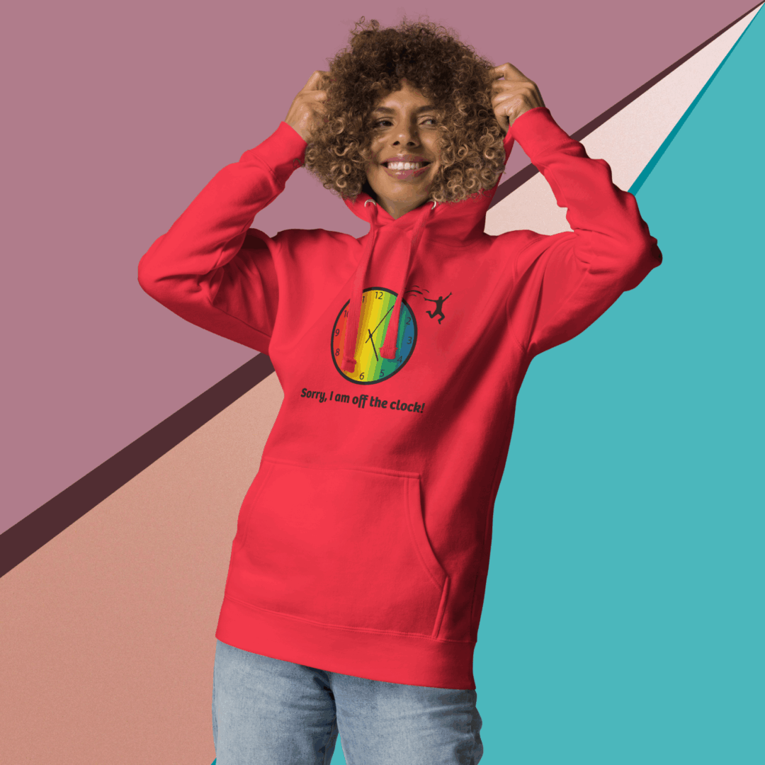 cotton-heritage-m2580-i-unisex-premium-pullover-hoodie-team-red-front-68e3254336d30 Smiling person wearing a red hoodie with a colorful graphic.