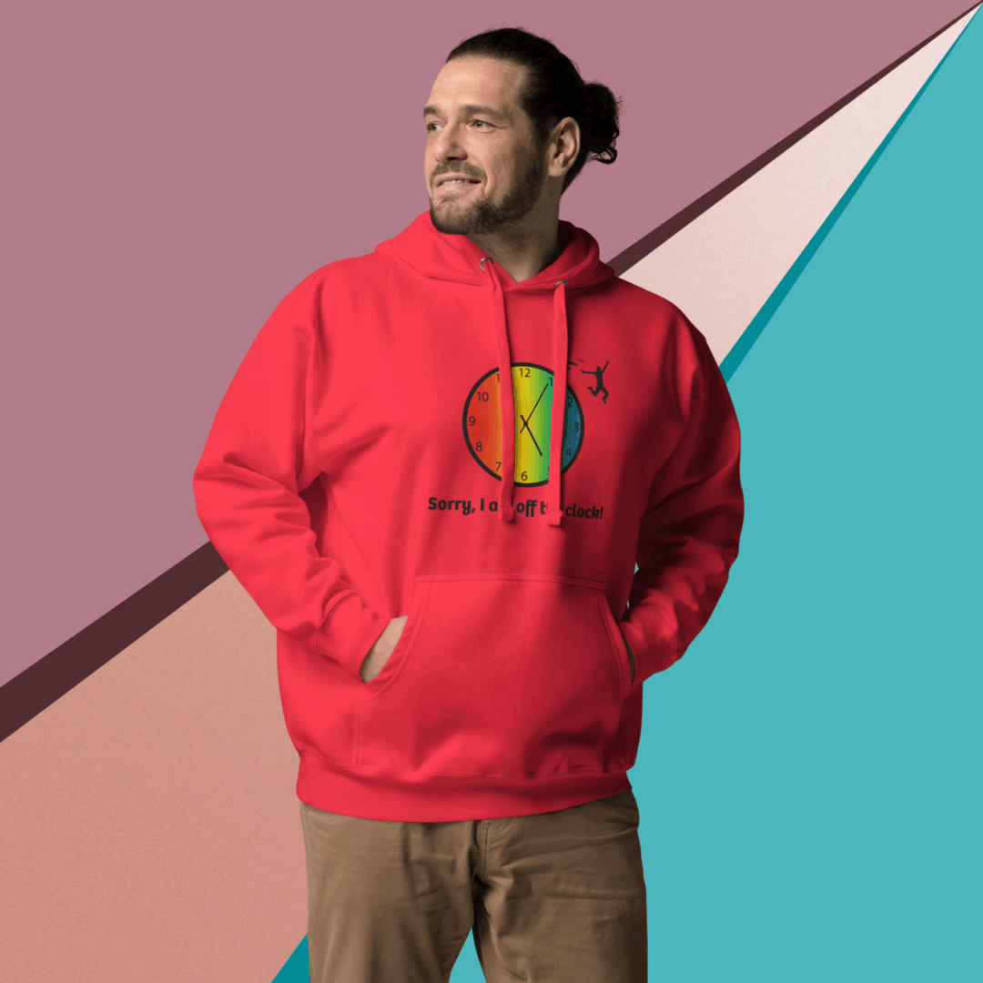 cotton-heritage-m2580-i-unisex-premium-pullover-hoodie-team-red-front-68e3260151784 Man wearing a bright red hoodie against a colorful geometric background.