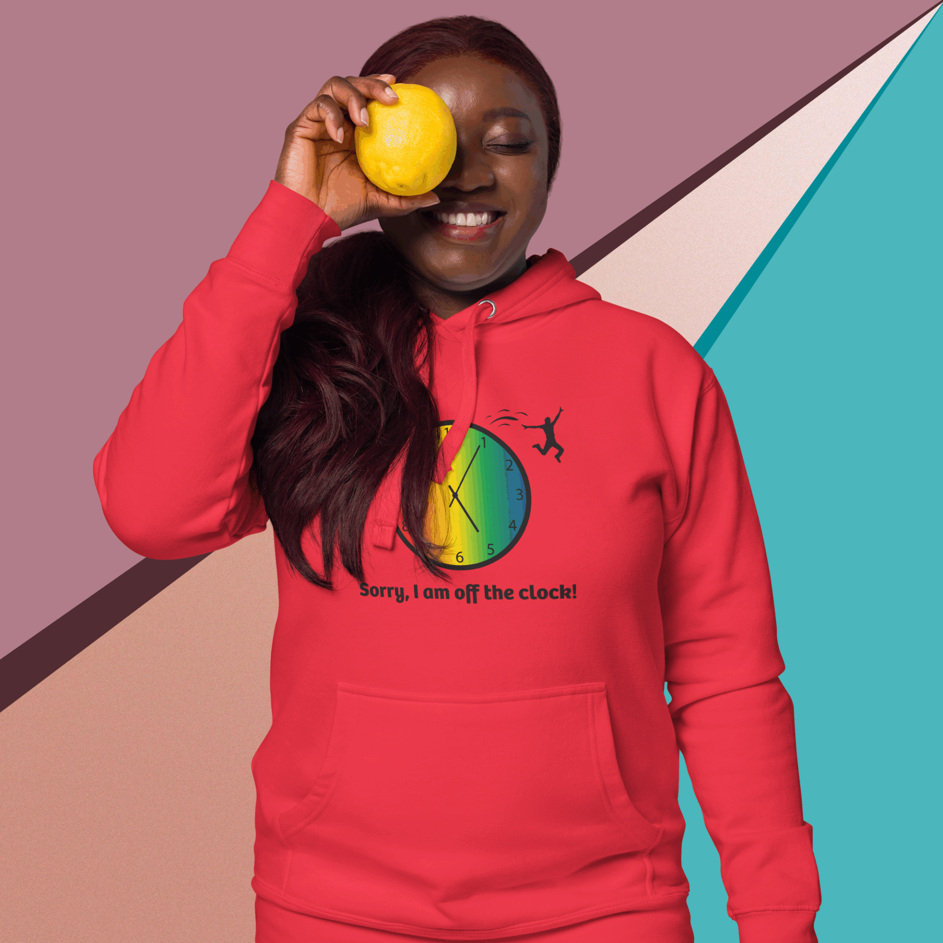 cotton-heritage-m2580-i-unisex-premium-pullover-hoodie-team-red-front-68e326df1fb59 Smiling woman in a red hoodie holding an orange slice over one eye.
