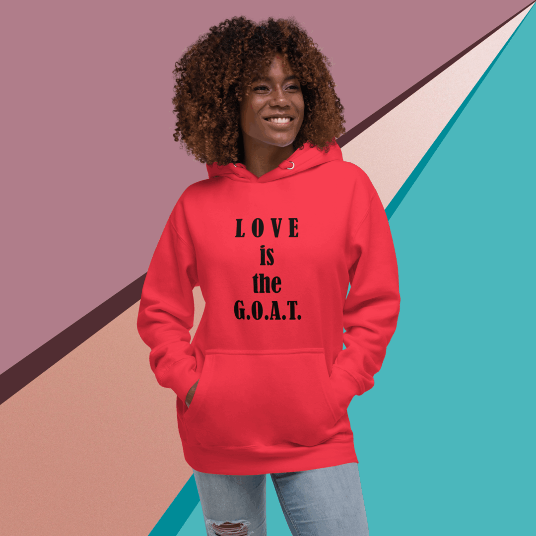 Person wearing a red hoodie with 'LOVE is the G.O.A.T.' text.