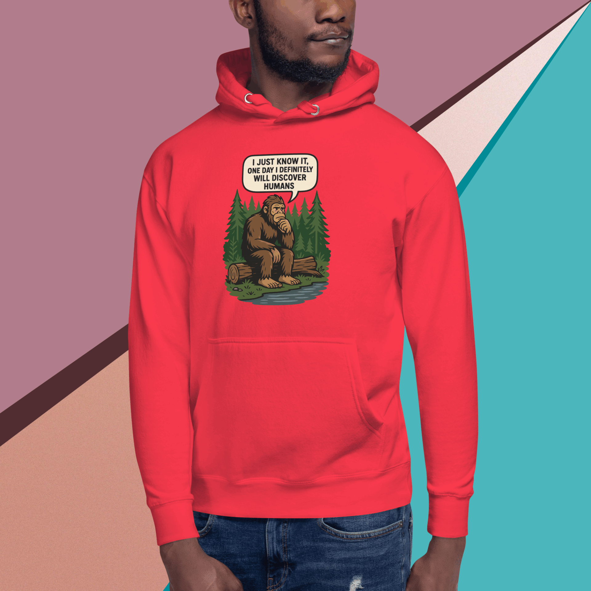 Man wearing a red hoodie with a bear and text design.