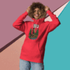 Smiling person in a red hoodie against a colorful geometric background.