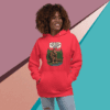 Woman in red hoodie smiling against colorful geometric background.