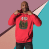 Man in a red hoodie striking a confident pose against a colorful geometric background.