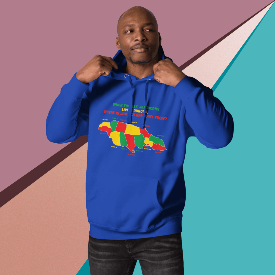 Man in blue hoodie posing against colorful geometric background.