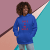 Smiling woman wearing a blue hoodie with red text.