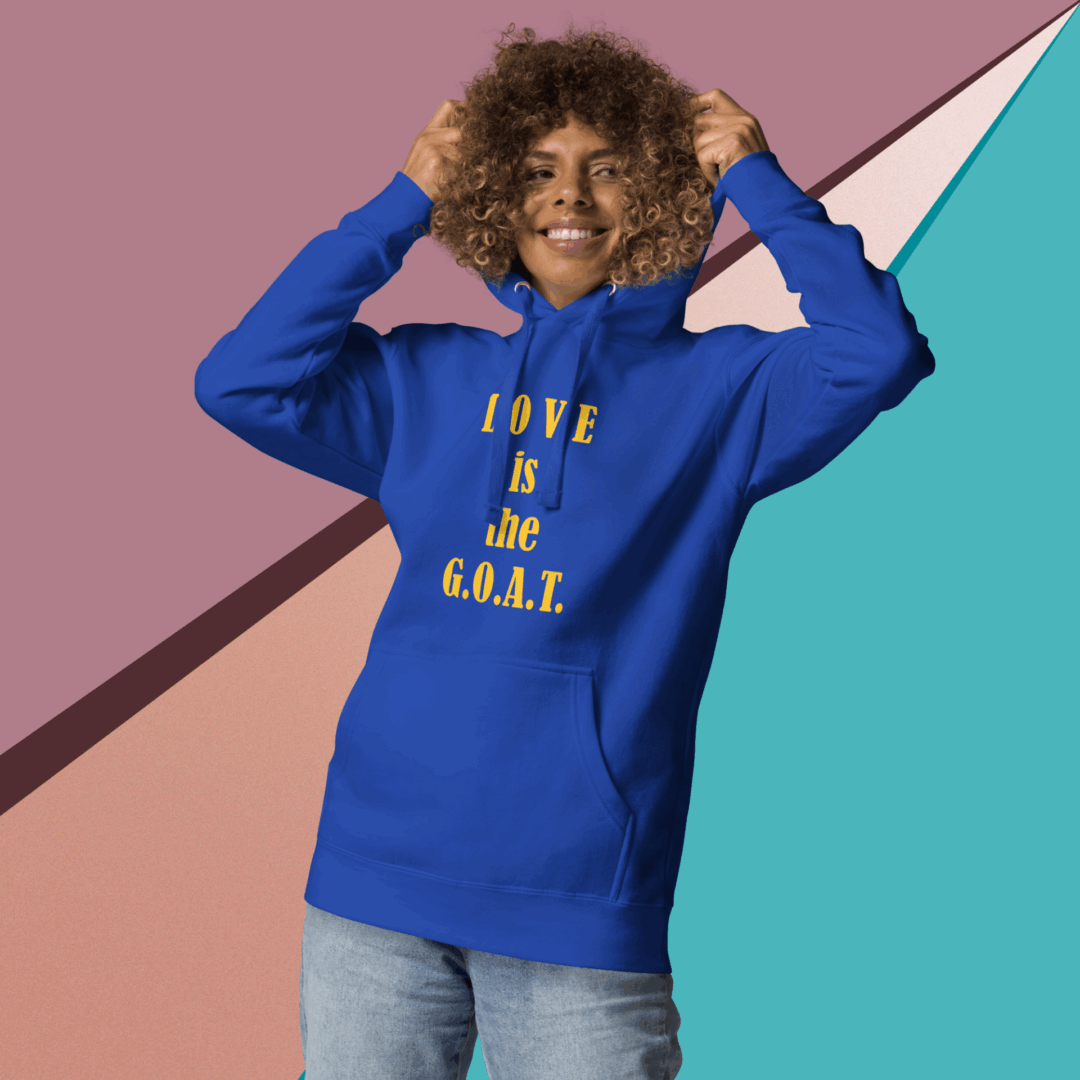 Person wearing a blue hoodie with 'LOVE IS REAL' text.