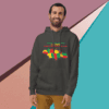 Man wearing a dark hoodie with a colorful map design and text.