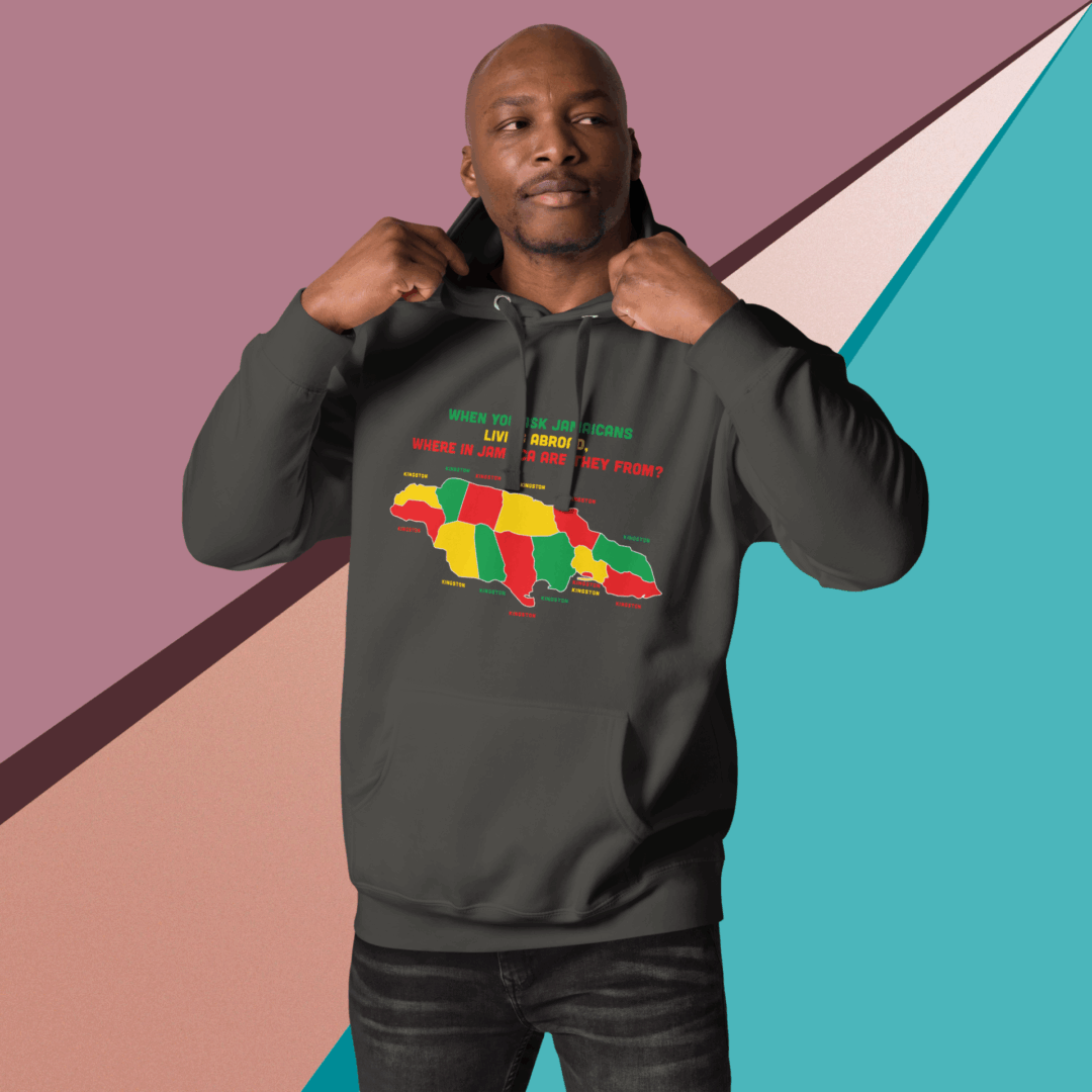 Man wearing a black hoodie with a colorful lion design and Rastafarian colors.