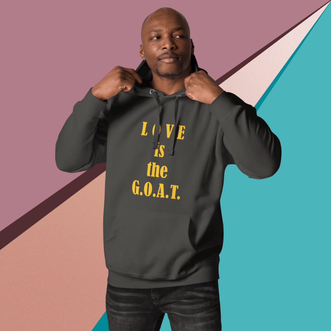 Man pointing to his sweatshirt with bold text.