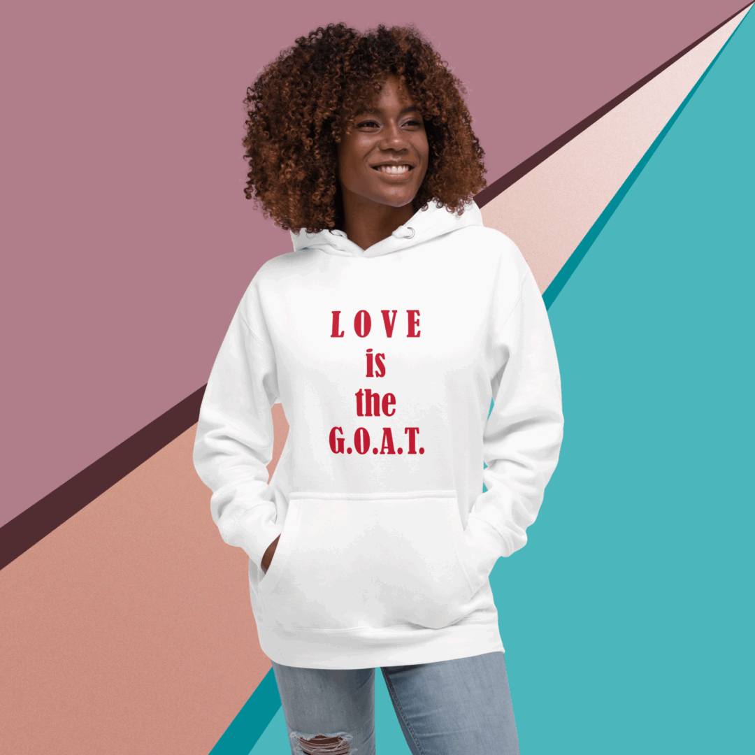 Smiling woman wearing a white hoodie with 'LOVE is G.O.L.D.' text.