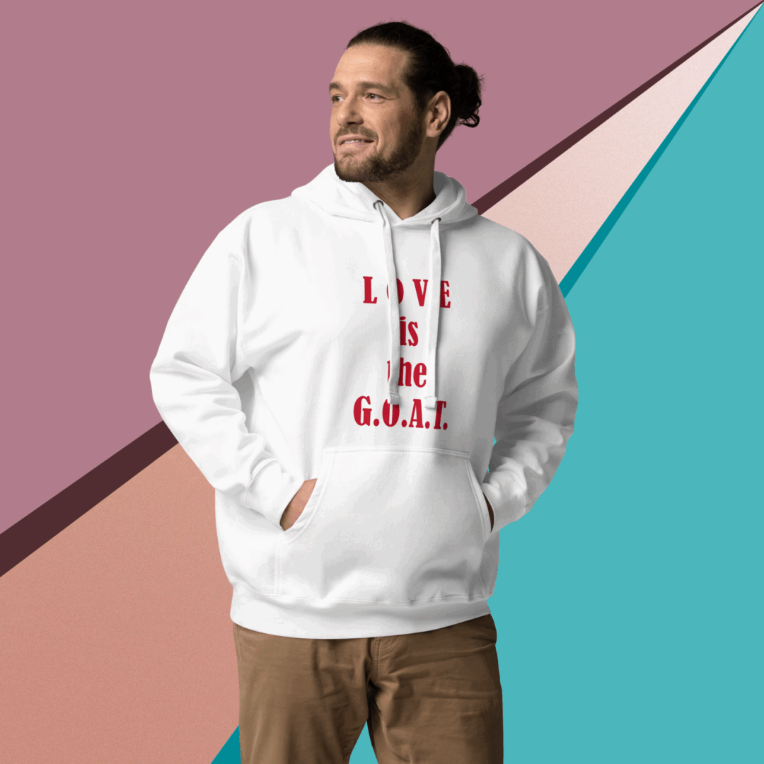 Man wearing a white hoodie with text, standing against a colorful geometric background.