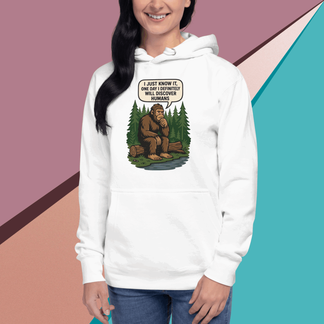 White hoodie with a Bigfoot cartoon and humorous text.