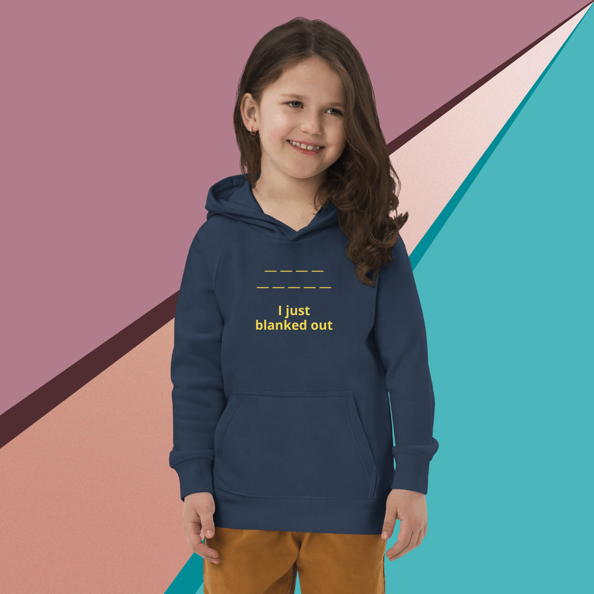 Smiling child in a navy hoodie with text, holding a book against a geometric background.