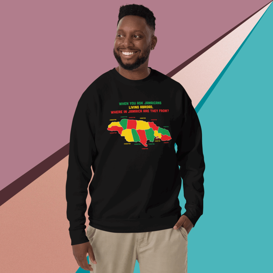Man smiling wearing a black sweatshirt with a colorful African continent design.