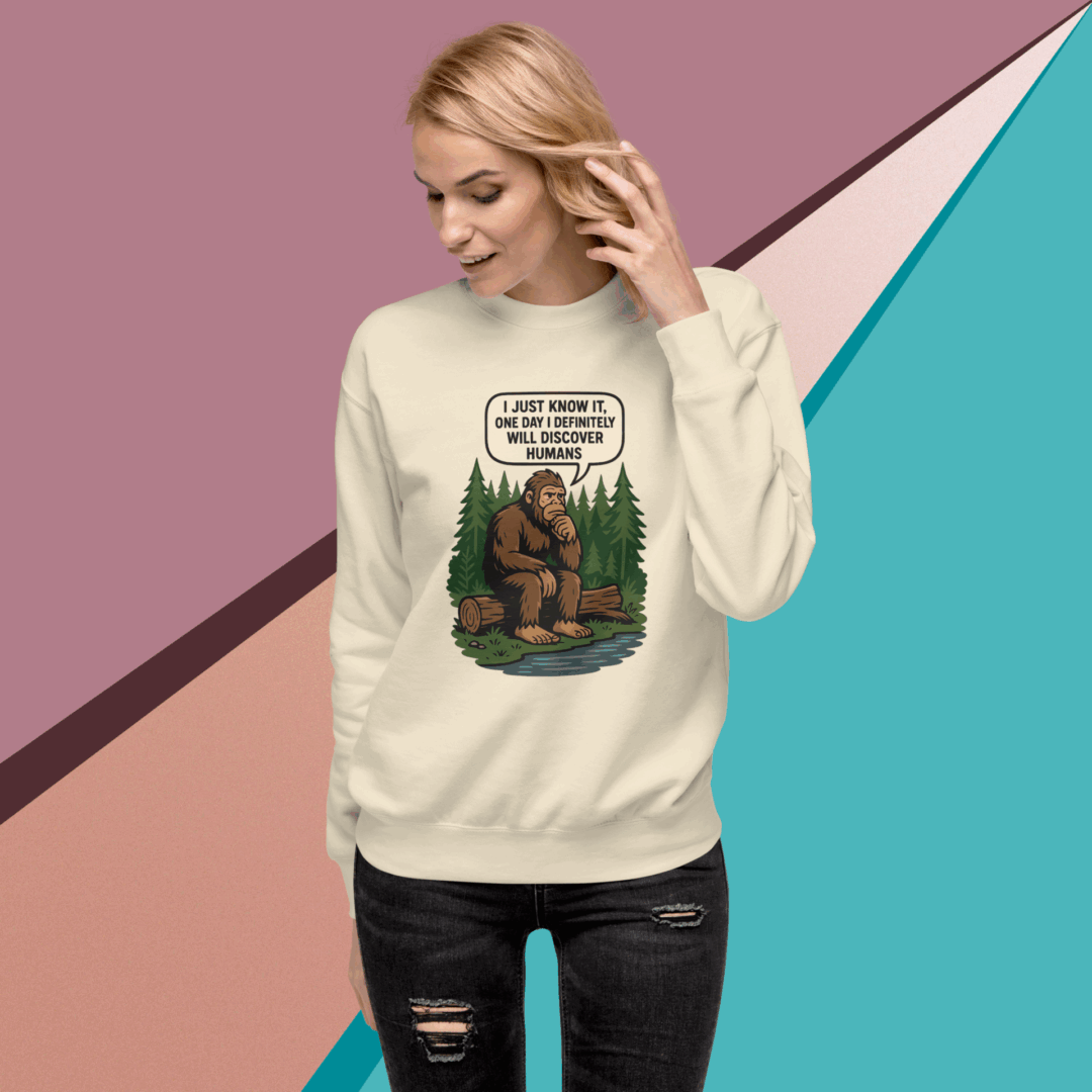 Woman wearing a white sweatshirt with a nature-themed graphic design.