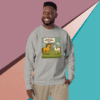 Smiling man wearing a gray sweatshirt with a colorful animal graphic design.