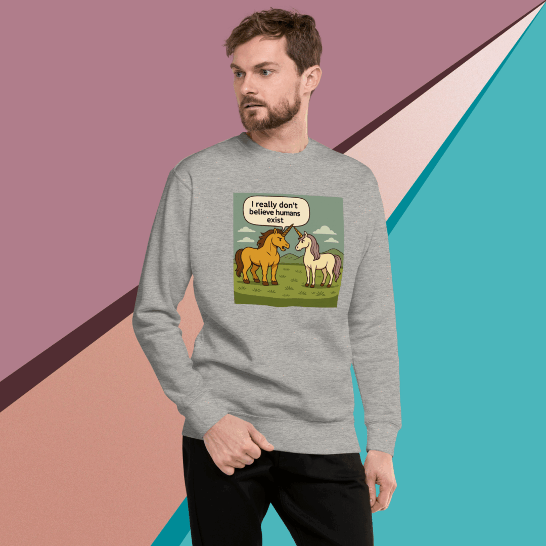 Man wearing a sweatshirt with a humorous dog and cat cartoon design.