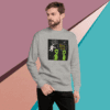 Man wearing grey sweatshirt with humorous alien graphic print.