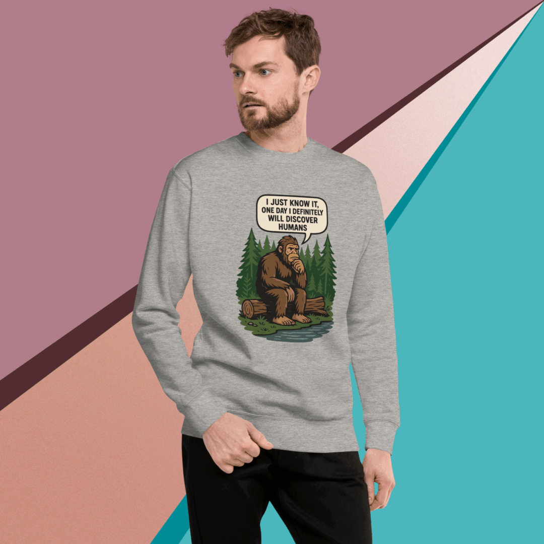 Man wearing a grey sweatshirt with a gorilla and humorous text design.