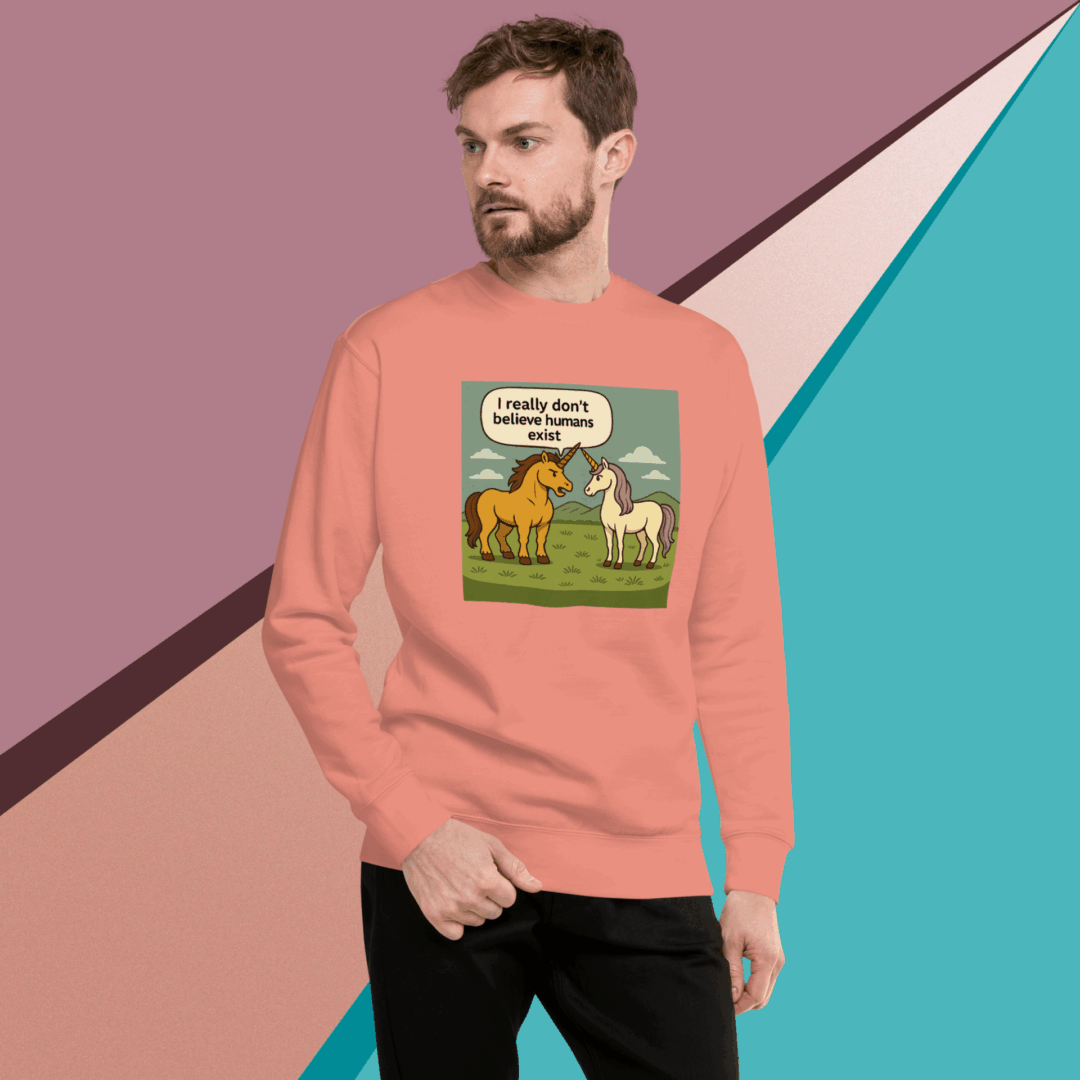 Man in peach sweatshirt with a cartoon lion and text design.