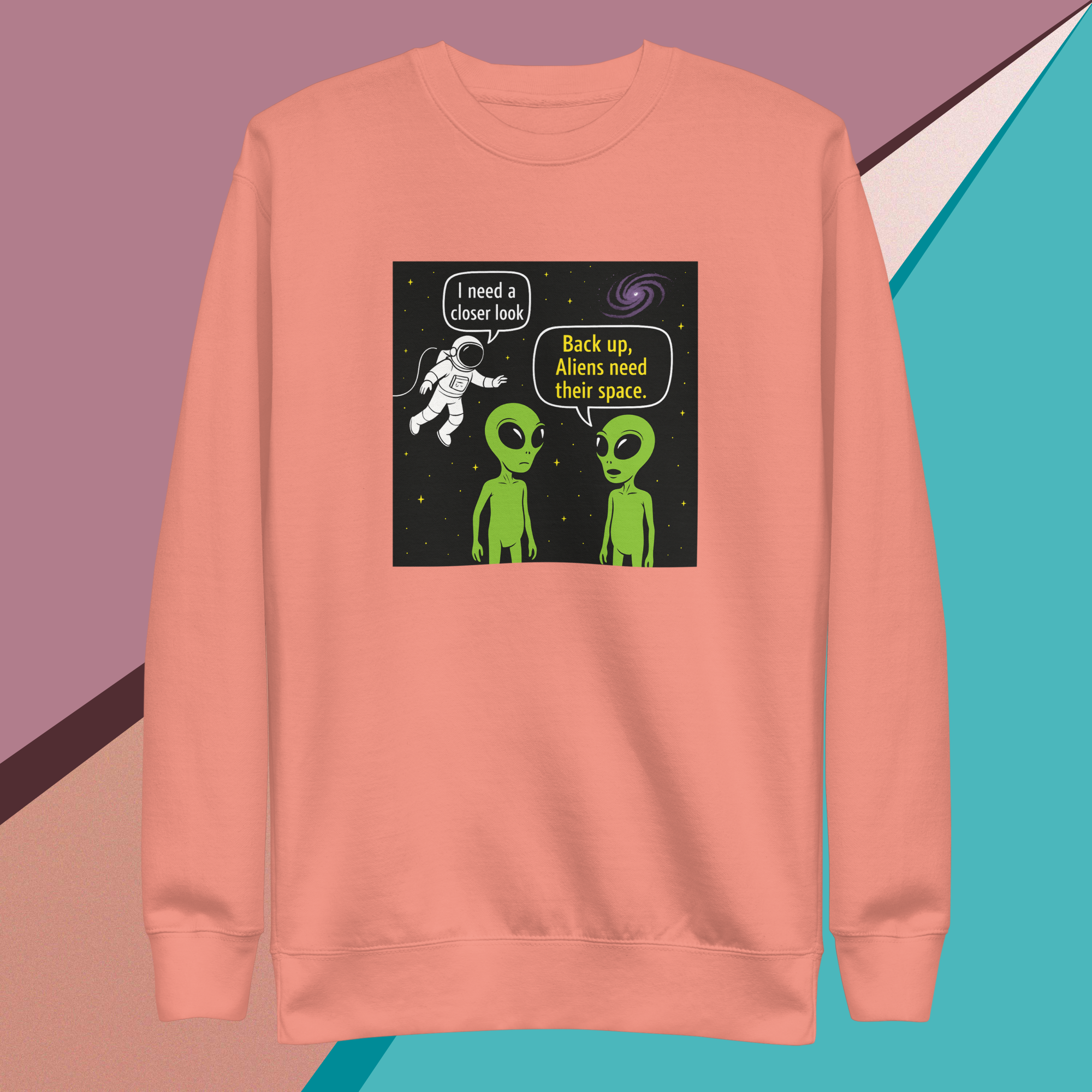 Peach sweatshirt with aliens telling astronaut to back up for space.