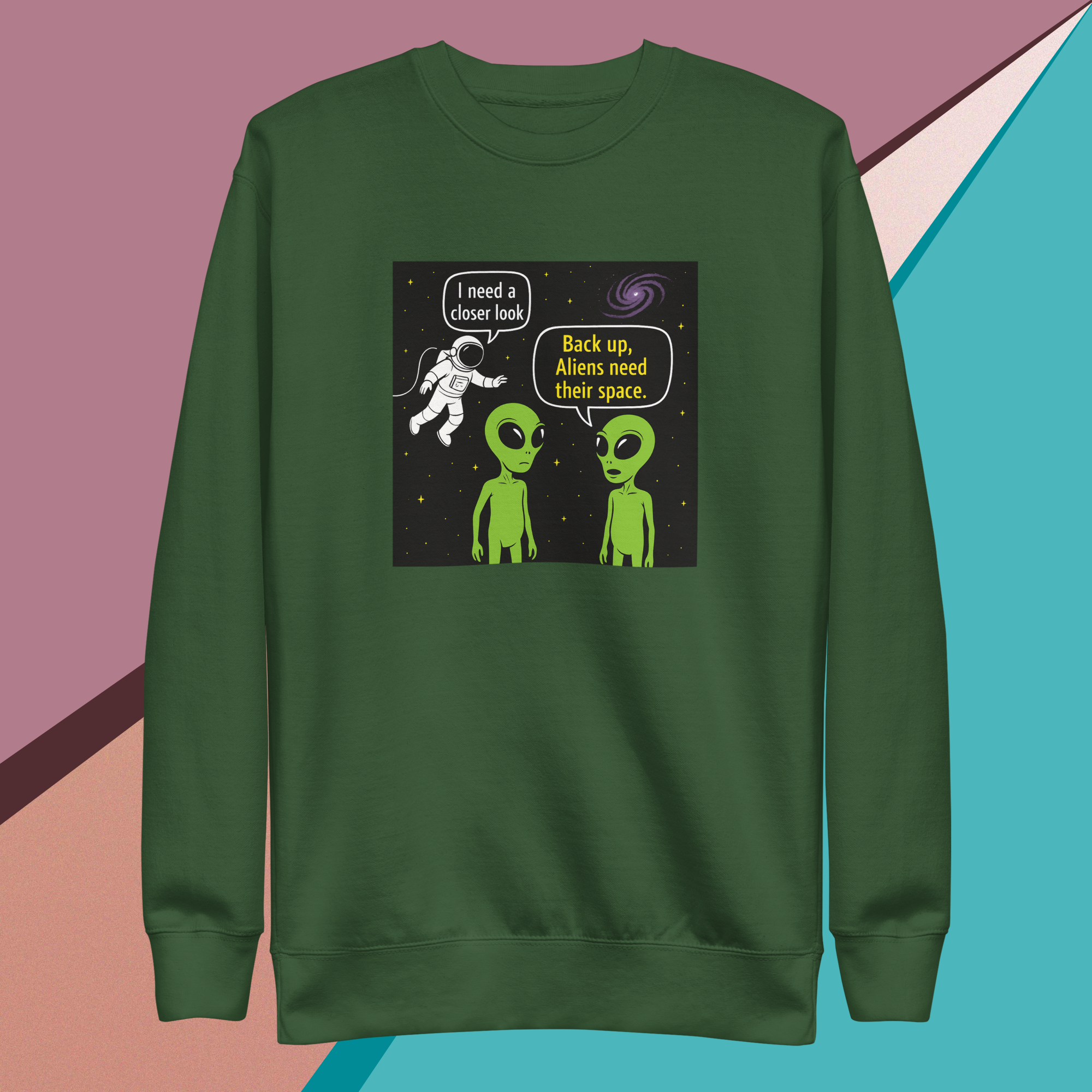 Green sweatshirt with a humorous alien and astronaut comic print.