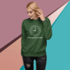 Woman wearing a green sweatshirt with a clock and text design.