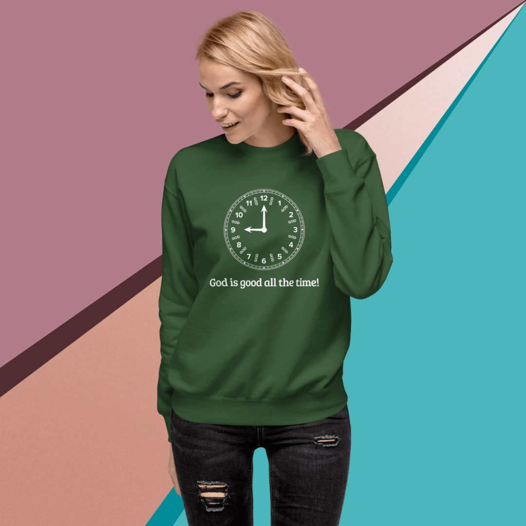 Woman wearing a green sweatshirt with a clock and text design.