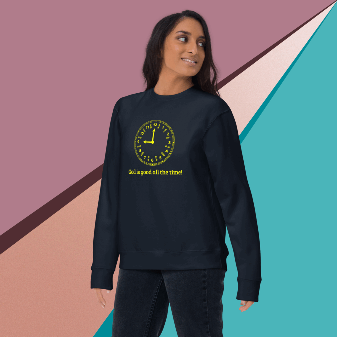 Woman wearing a black sweatshirt with a yellow graphic design.