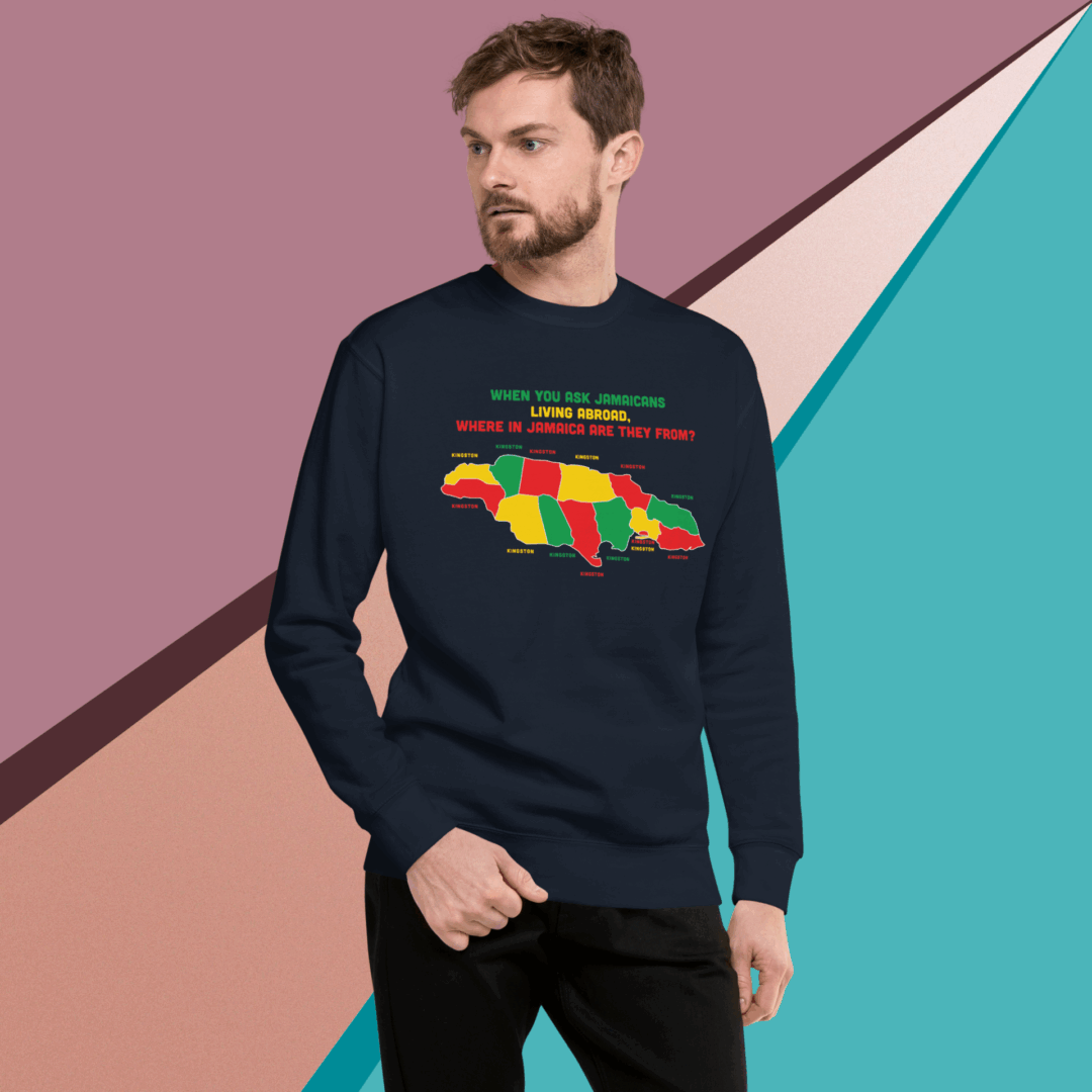 Man wearing a colorful map-themed sweatshirt against a geometric background.